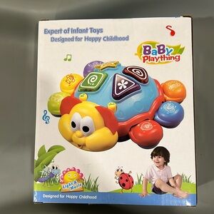 Musical ladybug toy- NWT. Learn letters, colors, numbers, shapes & music
